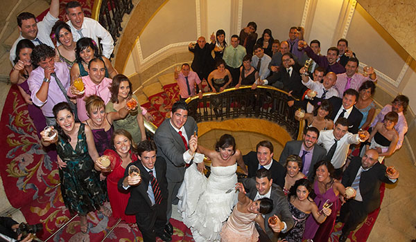 Guests group with bride and groom in a spiral staircase, Bilbao, Basque Country